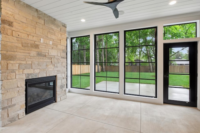 5924 Drew Ave S, Edina, MN 55410 - unfurnished living room featuring ceiling fan, healthy amount of natural light, a fireplace, and wooden ceiling