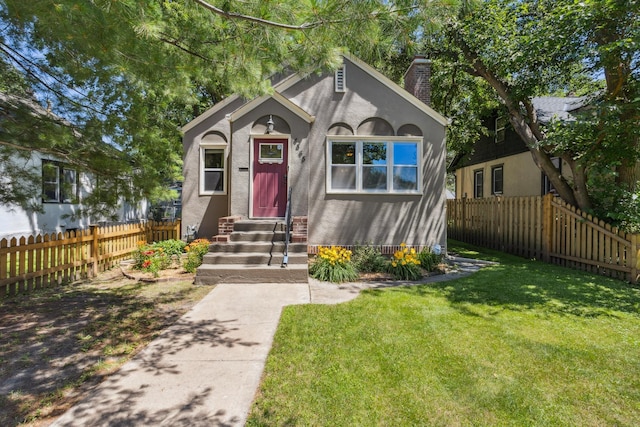 4545 5th Ave S, Minneapolis, MN 55419 - view of front of home with a chimney, entry steps, and stucco siding