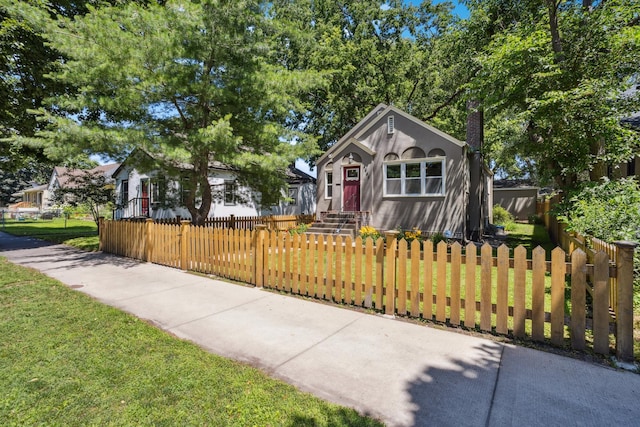 4545 5th Ave S, Minneapolis, MN 55419 - view of front of home featuring a chimney, stucco siding, and a fenced front yard