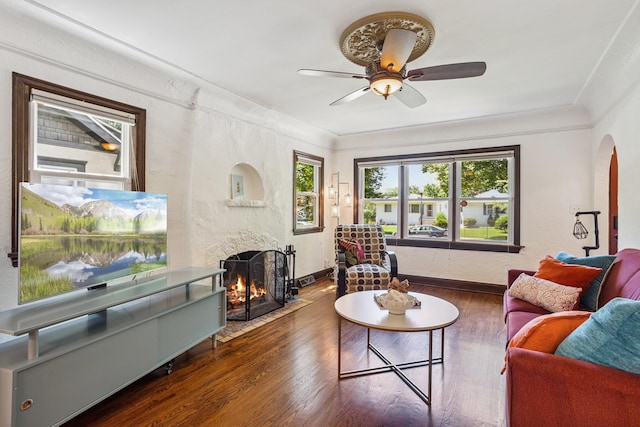 4545 5th Ave S, Minneapolis, MN 55419 - living area with a fireplace, wood finished floors, arched walkways, a ceiling fan, and a textured wall