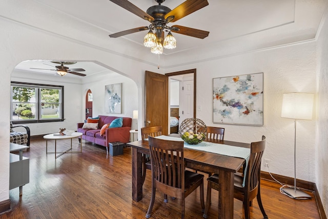4545 5th Ave S, Minneapolis, MN 55419 - dining area featuring arched walkways, a ceiling fan, wood finished floors, a textured wall, and crown molding