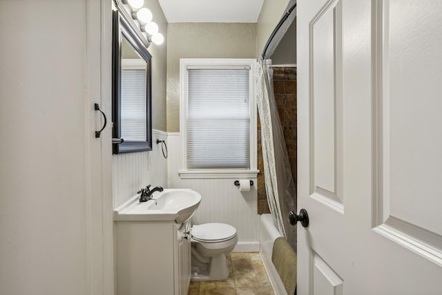 4545 5th Ave S, Minneapolis, MN 55419 - full bathroom with vanity, a wainscoted wall, and shower / bath combo with shower curtain