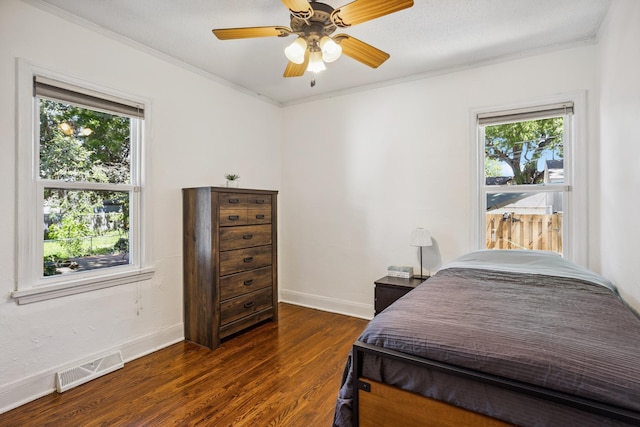 4545 5th Ave S, Minneapolis, MN 55419 - bedroom featuring multiple windows, crown molding, dark wood finished floors, and ceiling fan
