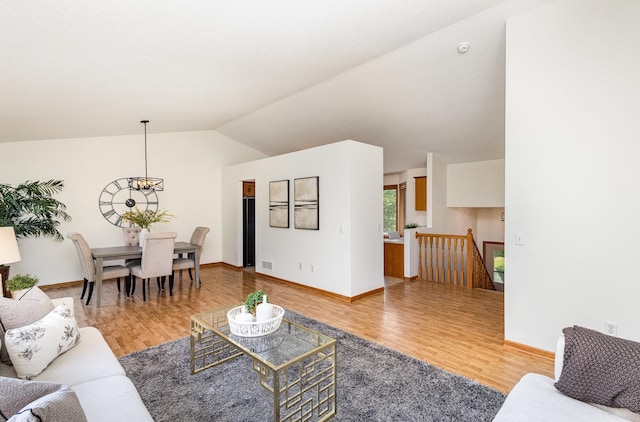 6122 152nd St N, Hugo, MN 55038 - living room featuring wood finished floors, vaulted ceiling, and baseboards