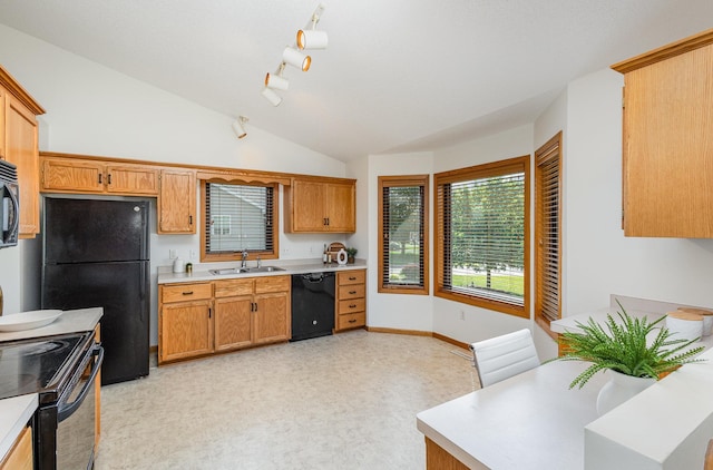 6122 152nd St N, Hugo, MN 55038 - kitchen featuring black appliances, a sink, light countertops, baseboards, and vaulted ceiling