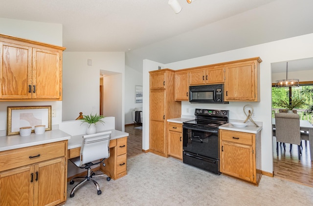 6122 152nd St N, Hugo, MN 55038 - kitchen featuring black appliances, vaulted ceiling, light countertops, light flooring, and a desk