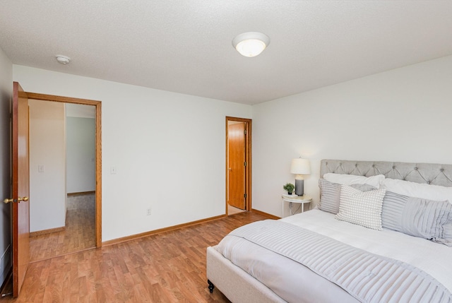 6122 152nd St N, Hugo, MN 55038 - bedroom with light wood-style floors and baseboards