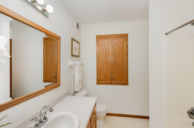 6122 152nd St N, Hugo, MN 55038 - bathroom with vanity, toilet, and baseboards