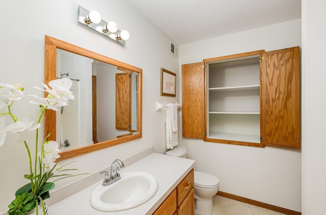6122 152nd St N, Hugo, MN 55038 - bathroom with vanity, toilet, baseboards, and a textured ceiling