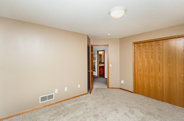 6122 152nd St N, Hugo, MN 55038 - unfurnished bedroom featuring carpet flooring, a closet, and baseboards