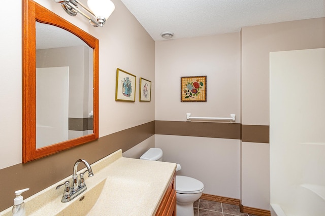 6122 152nd St N, Hugo, MN 55038 - bathroom featuring toilet, vanity, tile patterned flooring, and a textured ceiling