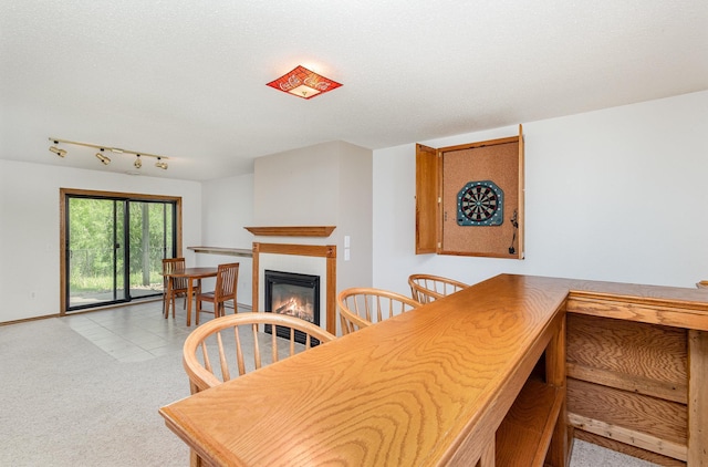 6122 152nd St N, Hugo, MN 55038 - dining room with a glass covered fireplace, baseboards, and light carpet