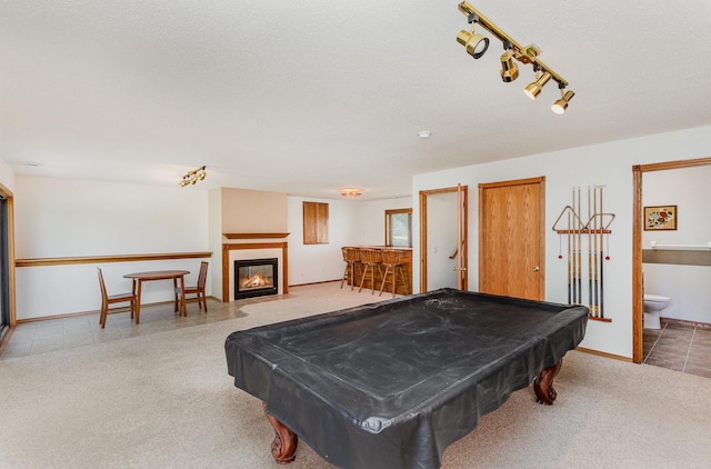 6122 152nd St N, Hugo, MN 55038 - rec room featuring carpet, pool table, a fireplace with flush hearth, and track lighting