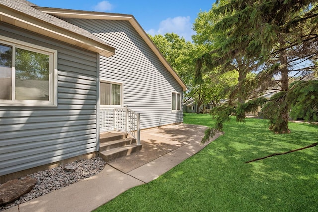 2639 Lake Court Cir Unit 81, Mounds View, MN 55112 - view of side of home featuring a yard and a patio