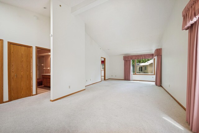 2639 Lake Court Cir Unit 81, Mounds View, MN 55112 - unfurnished living room featuring high vaulted ceiling, light colored carpet, and baseboards
