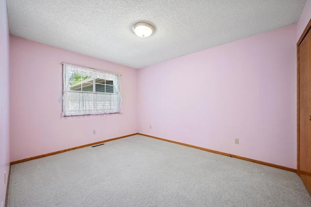 2639 Lake Court Cir Unit 81, Mounds View, MN 55112 - carpeted empty room with baseboards and a textured ceiling