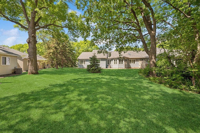 2639 Lake Court Cir Unit 81, Mounds View, MN 55112 - view of grassy yard with cooling unit