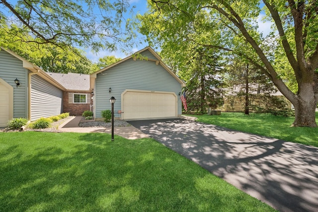 2639 Lake Court Cir Unit 81, Mounds View, MN 55112 - ranch-style home featuring a front lawn, a garage, and brick siding