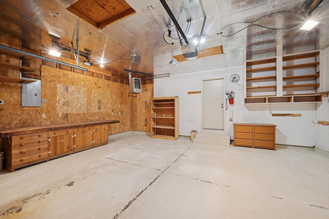 2639 Lake Court Cir Unit 81, Mounds View, MN 55112 - garage featuring electric panel and a garage door opener