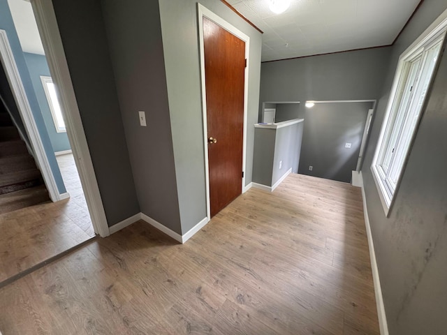 301 Legion Field Rd, Marshall, MN 56258 - hallway with wood finished floors, baseboards, and stairway