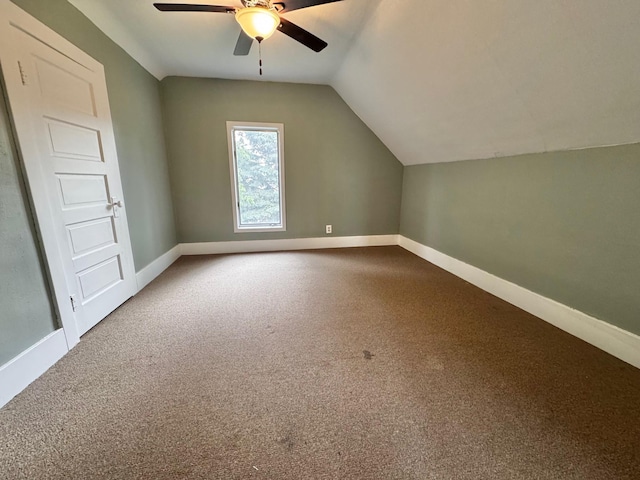 301 Legion Field Rd, Marshall, MN 56258 - additional living space featuring baseboards, ceiling fan, vaulted ceiling, and carpet flooring