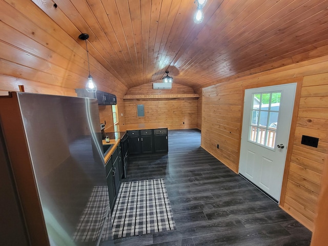 46625 High Dr, Kathio Twp, MN 56450 - kitchen with wood walls, vaulted ceiling, freestanding refrigerator, wood ceiling, and dark wood-type flooring