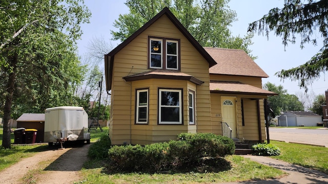 229 2nd Ave, Wanamingo, MN 55983 - view of front facade with roof with shingles