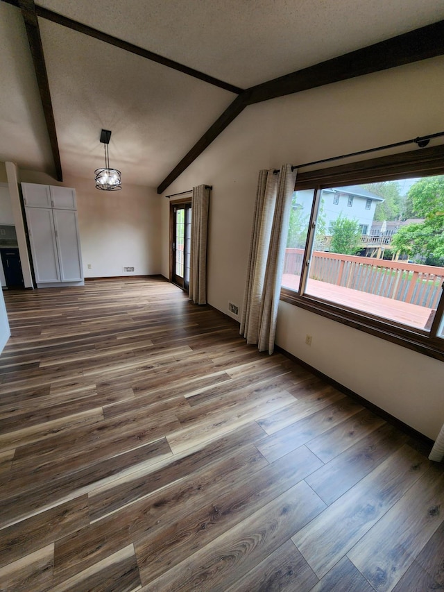 1180 Hathaway Ln NE, Fridley, MN 55432 - unfurnished living room featuring wood finished floors, a chandelier, and baseboards