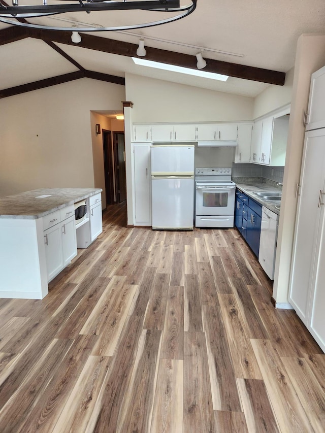 1180 Hathaway Ln NE, Fridley, MN 55432 - kitchen with white appliances, under cabinet range hood, white cabinets, wood finished floors, and a sink