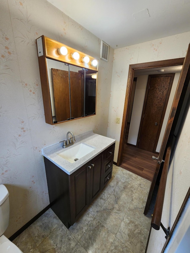 1180 Hathaway Ln NE, Fridley, MN 55432 - half bath featuring toilet and vanity