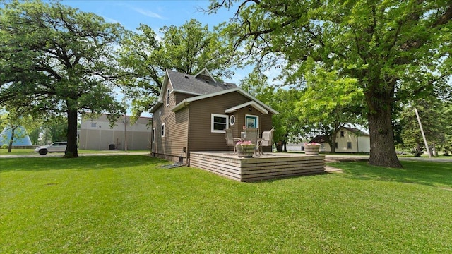 401 Main St, Osakis, MN 56360 - rear view of property featuring a lawn