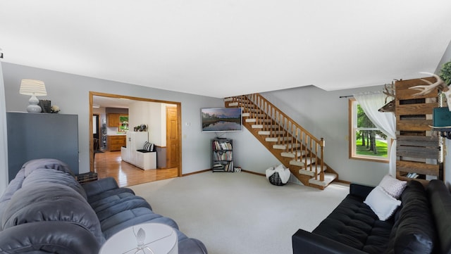 401 Main St, Osakis, MN 56360 - living area featuring stairs, carpet, and baseboards