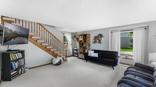 401 Main St, Osakis, MN 56360 - carpeted living room featuring stairway, a textured ceiling, and baseboards