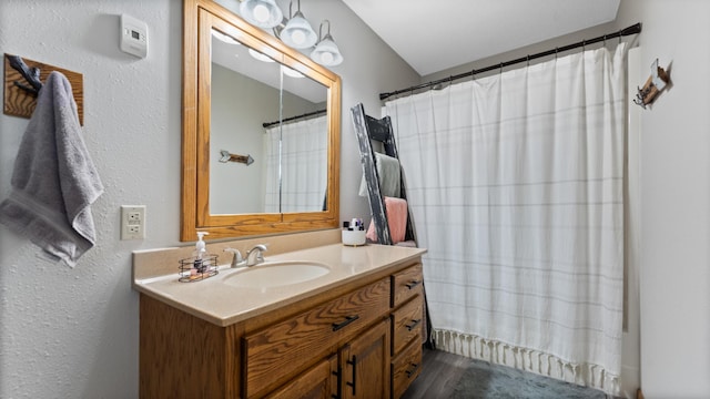 401 Main St, Osakis, MN 56360 - full bath with vanity, a shower with shower curtain, and a textured wall