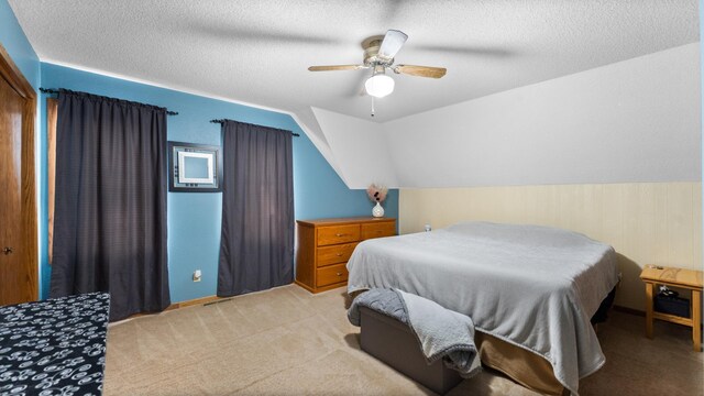 401 Main St, Osakis, MN 56360 - bedroom with a textured ceiling, lofted ceiling, light colored carpet, and ceiling fan