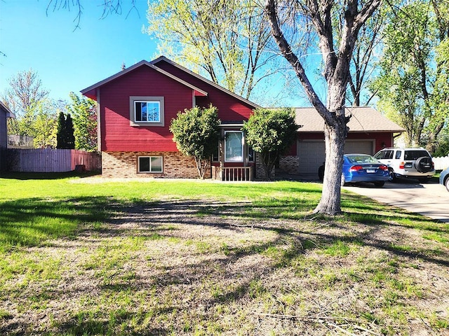 1687 131st Ln NW, Coon Rapids, MN 55448 - view of front of home with an attached garage, brick siding, and concrete driveway
