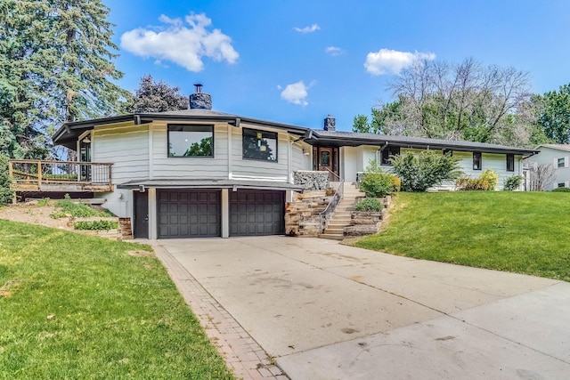 1000 Winston Cir, Mendota Heights, MN 55118 - view of front of house with an attached garage, stairway, a front yard, a chimney, and concrete driveway