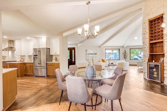 1000 Winston Cir, Mendota Heights, MN 55118 - dining space with wine cooler, light wood-type flooring, a chandelier, and baseboards