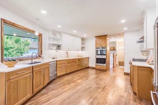 1000 Winston Cir, Mendota Heights, MN 55118 - kitchen with open shelves, appliances with stainless steel finishes, a sink, light wood finished floors, and light countertops