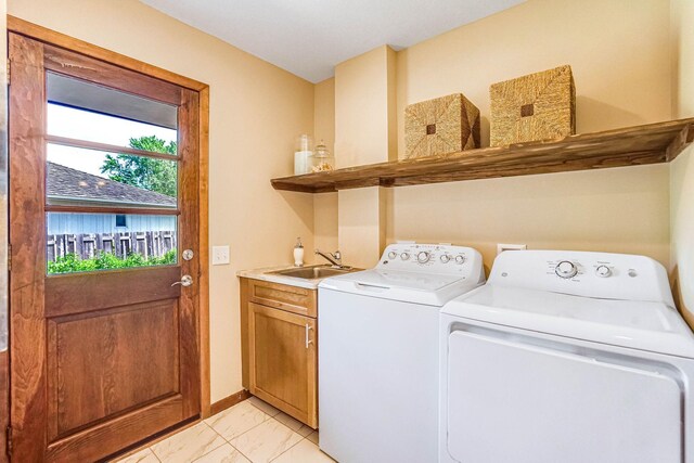 1000 Winston Cir, Mendota Heights, MN 55118 - laundry area with cabinet space, separate washer and dryer, light marble finish flooring, and baseboards