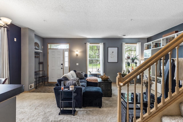 15359 Foliage Ave Unit 501, Apple Valley, MN 55124 - living area featuring carpet, a textured ceiling, and stairway