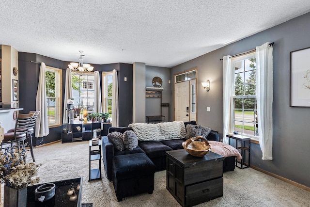15359 Foliage Ave Unit 501, Apple Valley, MN 55124 - living area featuring carpet, a chandelier, healthy amount of natural light, and a textured ceiling
