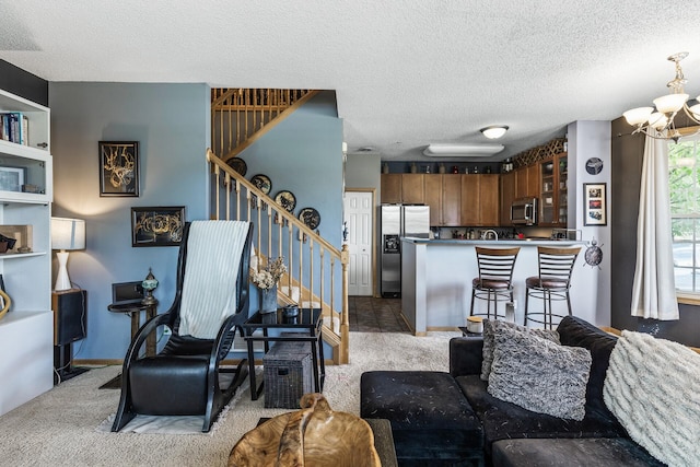 15359 Foliage Ave Unit 501, Apple Valley, MN 55124 - living area featuring stairs, a chandelier, a textured ceiling, and carpet floors