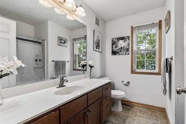 15359 Foliage Ave Unit 501, Apple Valley, MN 55124 - bathroom featuring plenty of natural light, vanity, a textured ceiling, and curtained shower