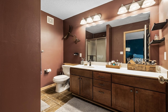 15359 Foliage Ave Unit 501, Apple Valley, MN 55124 - ensuite bathroom featuring a stall shower, tile patterned floors, double vanity, and a textured ceiling