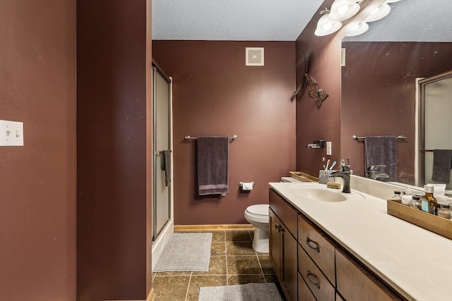 15359 Foliage Ave Unit 501, Apple Valley, MN 55124 - full bathroom with a shower with shower door, vanity, tile patterned flooring, and a textured ceiling