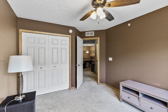 15359 Foliage Ave Unit 501, Apple Valley, MN 55124 - bedroom featuring light carpet, a closet, ceiling fan, and a textured ceiling