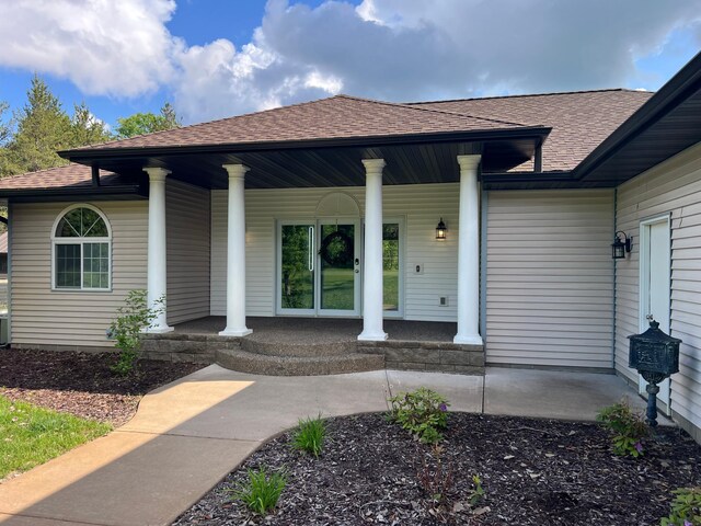 6563 Parkview Cir, Baxter, MN 56425 - doorway to property with covered porch and roof with shingles
