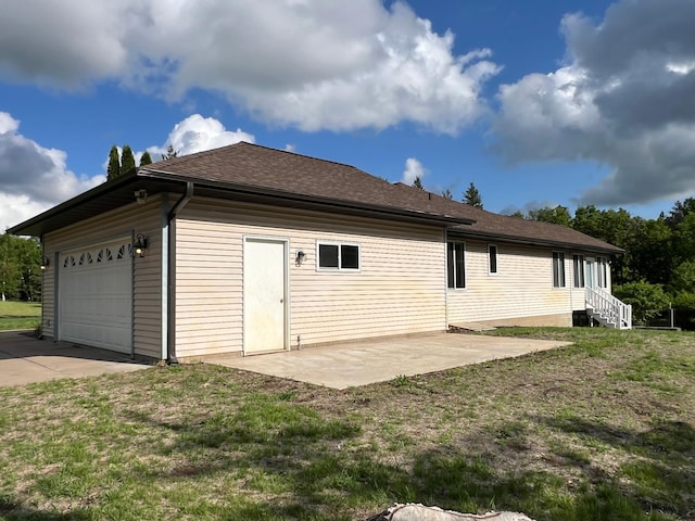 6563 Parkview Cir, Baxter, MN 56425 - rear view of house with a garage, a yard, and roof with shingles
