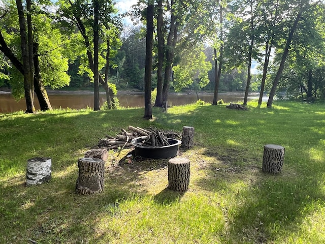 6563 Parkview Cir, Baxter, MN 56425 - view of grassy yard with a water view and an outdoor fire pit